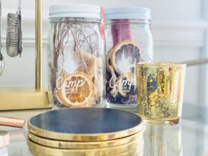 jars with dried fruit and gold and black coasters