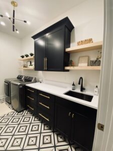 laundry room with black cabinets