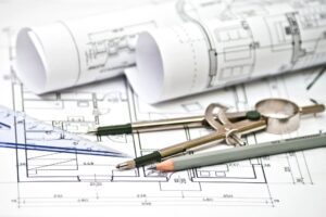 architect plans with pencil and blueprints