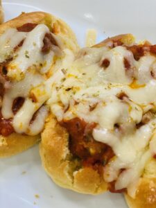 thumbnail baked potato with toppings and cheese